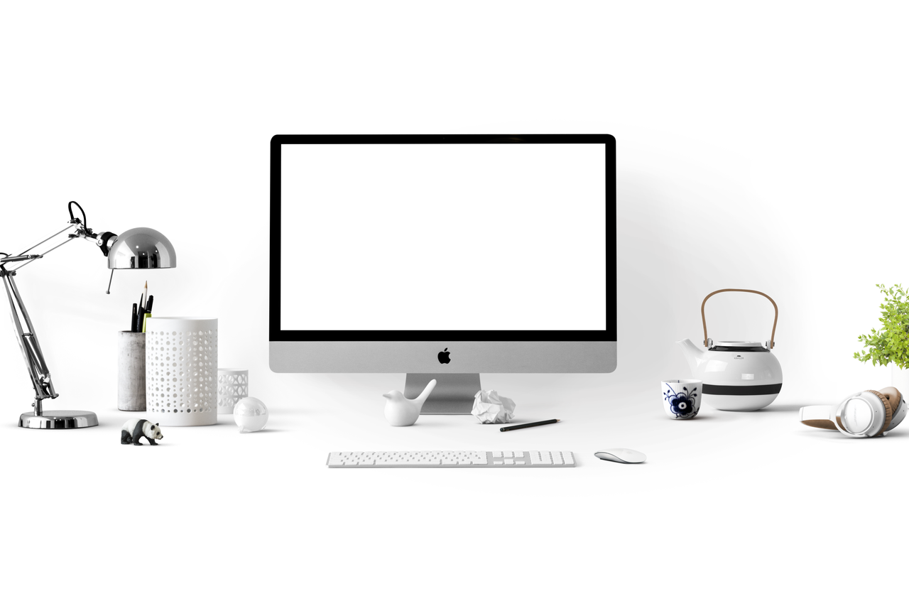heros-img Clean, minimalist office desk featuring an iMac, lamp, and stationery, ideal for tech-themed backgrounds.